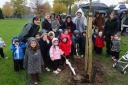 Manager Audrey Willoughley and 19 children from The Rocking Horse Nursery planted a tree