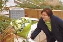 Not forgotten: Tanya Liu laying flowers at the site of the Potters Bar train crash