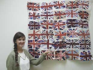 Lauderdale House's arts education officer Jill Wignall with a quilt inspired by World War Two