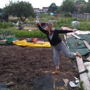 My wife Patricia at the allotment, performing oriental exercises
