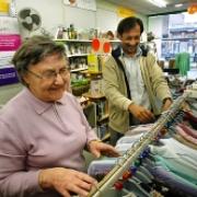 At your service: Ann Smith and Harish Shah at work in Barnado's