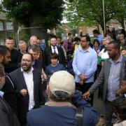 Hundreds of people from all different faiths attended a vigil after the blaze