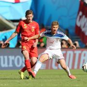 Jan Vertonghen (left) battles with Russia's Oleg Shatov (right). Picture: Action Images
