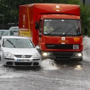 Heavy rain: roads such as this one in Mill Hill were flooded earlier this month