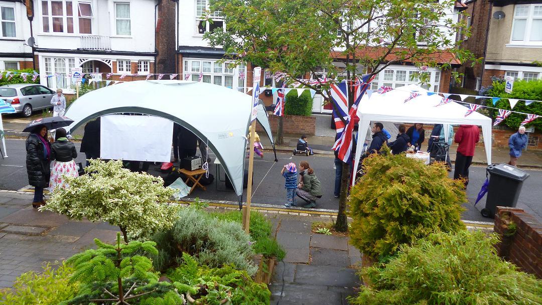 Dollis Park and District Residents' Association holds street party despite the rain