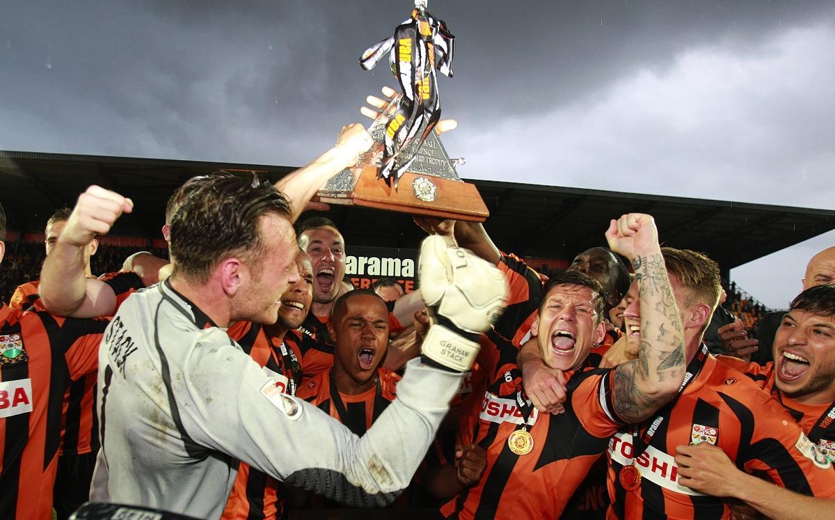 Graham Stack and other Barnet players with the trophy