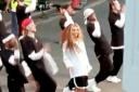 Video grab of ex-Little Mix singer Jesy Nelson appearing to film a new music video alongside a large dance group on August 4 on a street in Edgware. Credit: SWNS