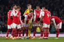 Arsenal players go into a huddle against Southampton