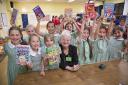 Jacqueline Wilson with pupils at Stormont School