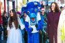 MP Teresa Villiers at last's year's parade, with the Christmas fairy, the Bull Theatre mascot and Santa Claus