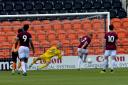 The key moment: Mark Cousins saves Anthony Scully's penalty. Pictures: Len Kerswill