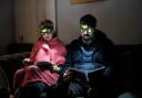 Moda Todorova (left) and her husband Chavdar (right) use head torches as lights to cut down their electricity bill