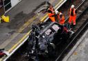 Images show a crumpled Range Rover on the tracks at Park Royal station