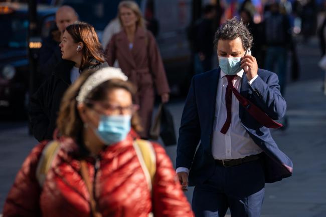 People wearing face masks on Oxford Street, in central London