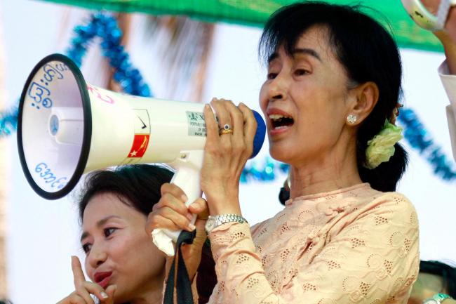 Aung San Suu Kyi speaks to her supporters using a loud-hailer
