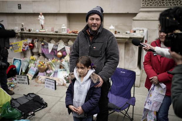 Times Series: Richard Ratcliffe, the husband of Iranian detainee Nazanin Zaghari-Ratcliffe, with his daughter Gabriella, he is ending his hunger strike in central London after almost three weeks. Credit: PA