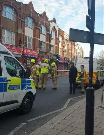 Times Series: Firefighters and police in Ballards Lane in North Finchley. Credit: Ian Pawley 