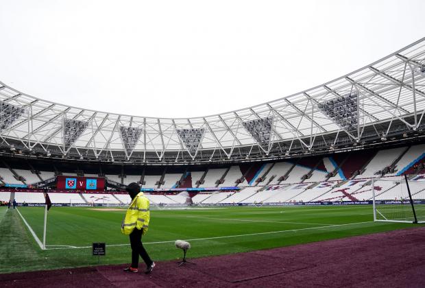 Times Series: A general view of a steward by the pitch before the Premier League match at the London Stadium, London