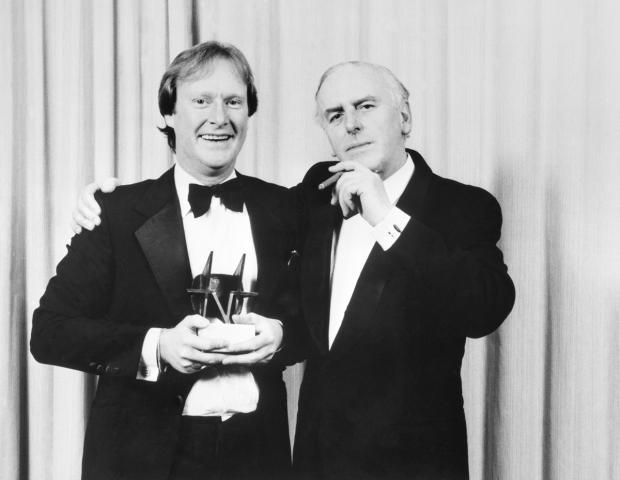 Times Series: Minder stars, Dennis Waterman (left) and George Cole with the Editor's Special Award for the programme at the TV Times magazine's awards ceremony. Picture: PA