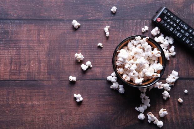 Times Series: A bowl of popcorn and a TV remote (Canva)
