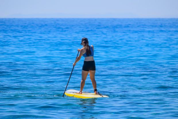 Times Series: A person paddleboarding (Canva)