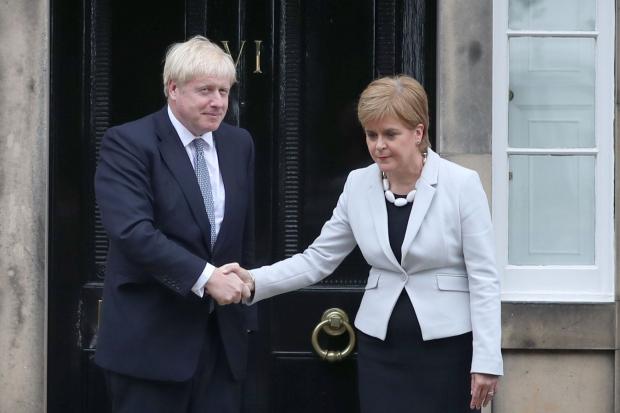 Boris Johnson and Nicola Sturgeon shaking hands