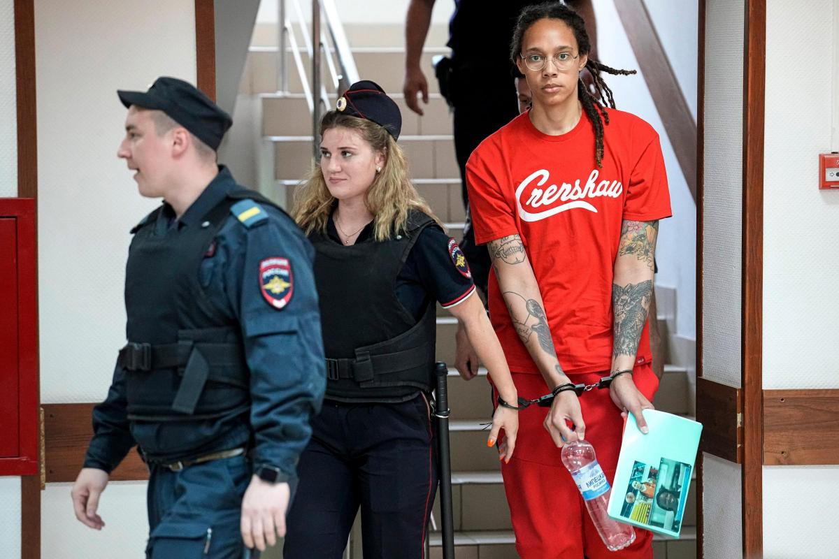Brittney Griner is escorted to a courtroom in Khimki, near Moscow