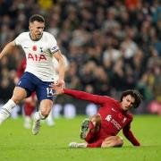 Tottenham Hotspur's Ivan Perisic and Liverpool's Trent Alexander-Arnold battle for the ball