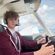 Flying high over north London... pupil learning to pilot a plane