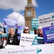 Campaigners gathered outside Parliament as a debate on assisted dying began (Jordan Pettitt/PA)