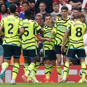 Leandro Trossard celebrates with Arsenal teammates at Old Trafford