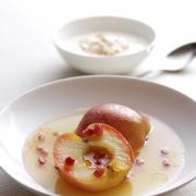 Poached Pink Lady apples in wine with orange and pomegranate