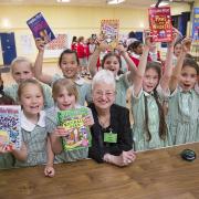 Jacqueline Wilson with pupils at Stormont School