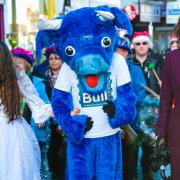 MP Teresa Villiers at last's year's parade, with the Christmas fairy, the Bull Theatre mascot and Santa Claus