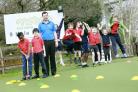 PGA professional Jonathan Law with some of the children taking part at the TriGolf tournament