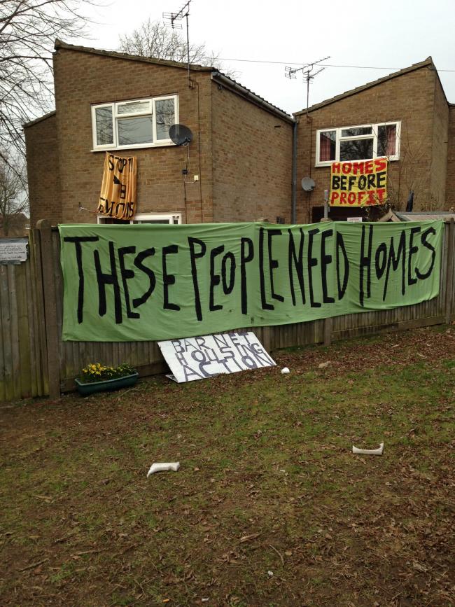 Banners adorn the occupied house in Sweets Way, Whetstone